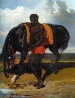 African keeping a horse at the side of a sea