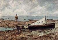 The gray day beach with fishermen and boats 